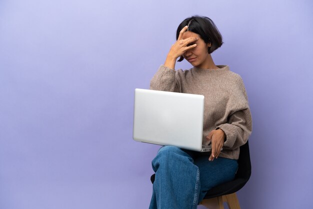 A person looking anxious at a laptop screen