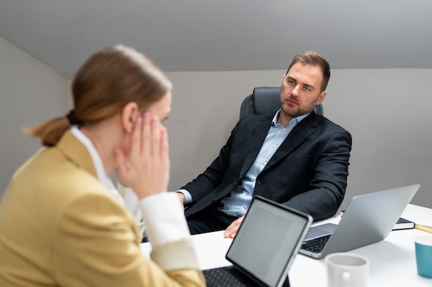 A person talking to another person, representing a problem interview