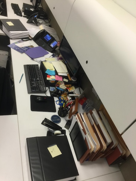A screenshot of a very cluttered desktop with many icons and files scattered everywhere.